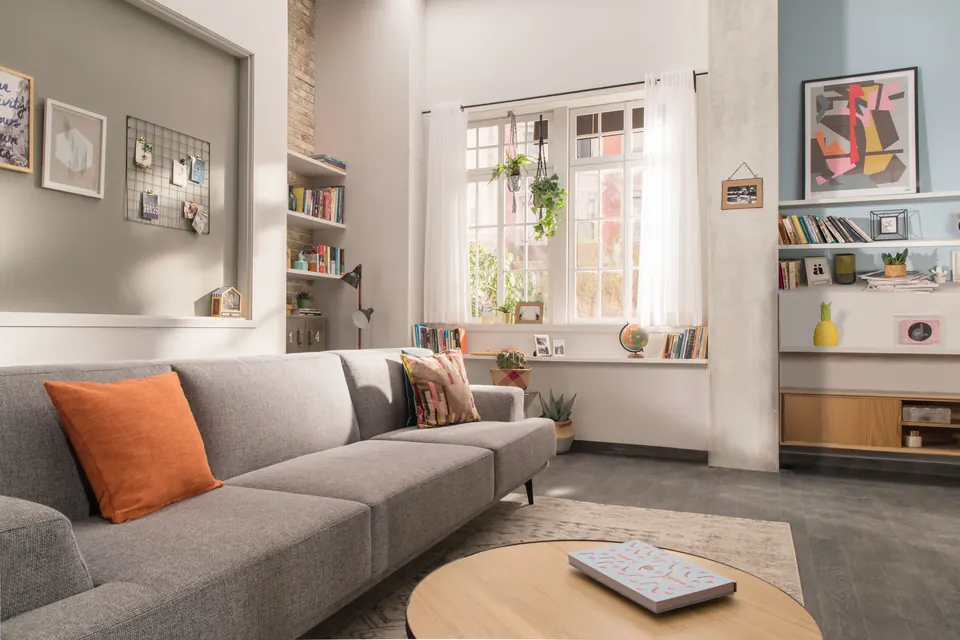 Calm, sunlit living room with soft seating