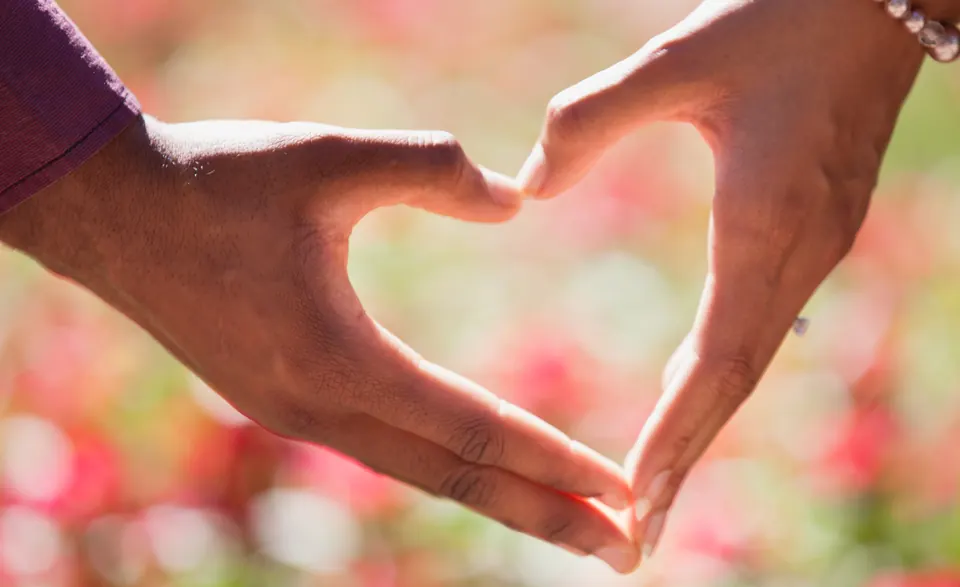 Two hands forming a heart shape