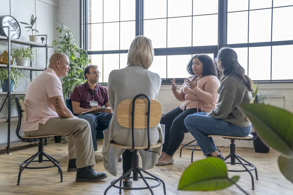 A peer support group talking together